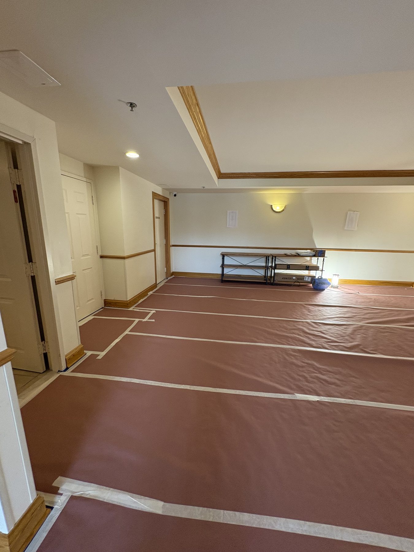 Floors protected with paper and tape before painting